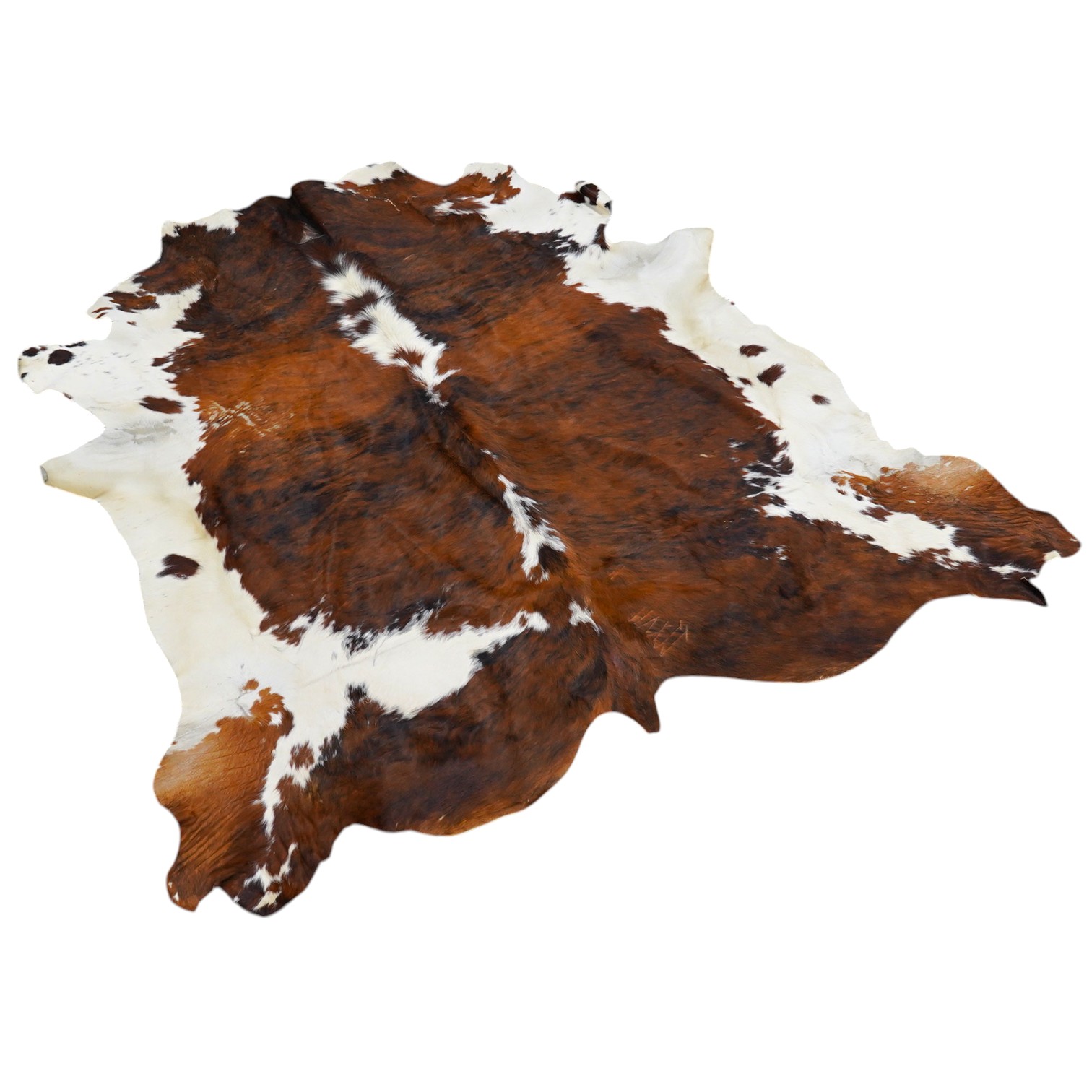 A brown and cream cowhide rug. Condition - fair, as per the images